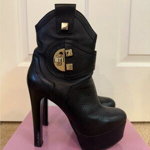 Black Leather Heeled Boots with Gold Accents
